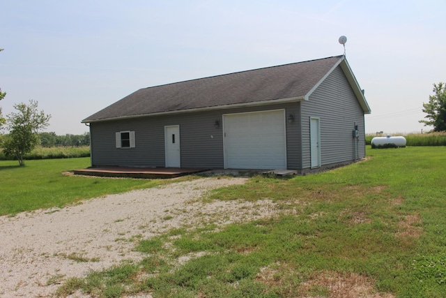 16666 Carle Springs Rd, Wapella, IL 61777 - view of front of house with a detached garage, dirt driveway, a front yard, and an outdoor structure