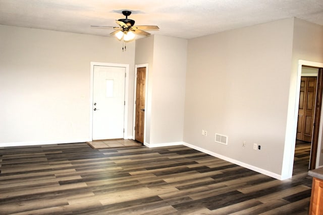 16666 Carle Springs Rd, Wapella, IL 61777 - empty room with dark wood-style floors and a ceiling fan