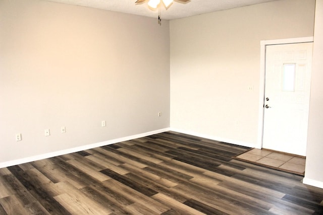 16666 Carle Springs Rd, Wapella, IL 61777 - empty room with ceiling fan and dark wood-type flooring