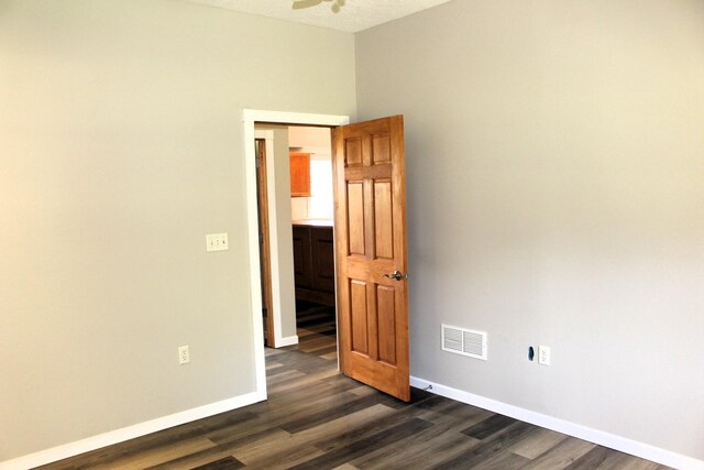 16666 Carle Springs Rd, Wapella, IL 61777 - unfurnished room featuring dark wood-style floors and ceiling fan