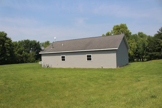16666 Carle Springs Rd, Wapella, IL 61777 - view of home's exterior with a lawn and a shingled roof