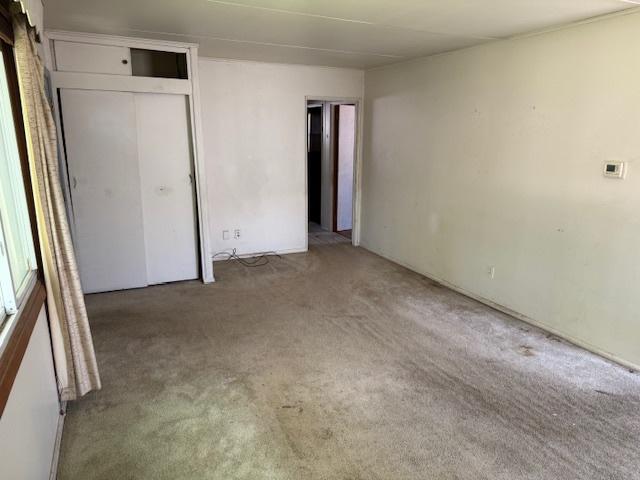 300 Notre Dame Ave, Joliet, IL 60436 - unfurnished bedroom featuring carpet and a closet