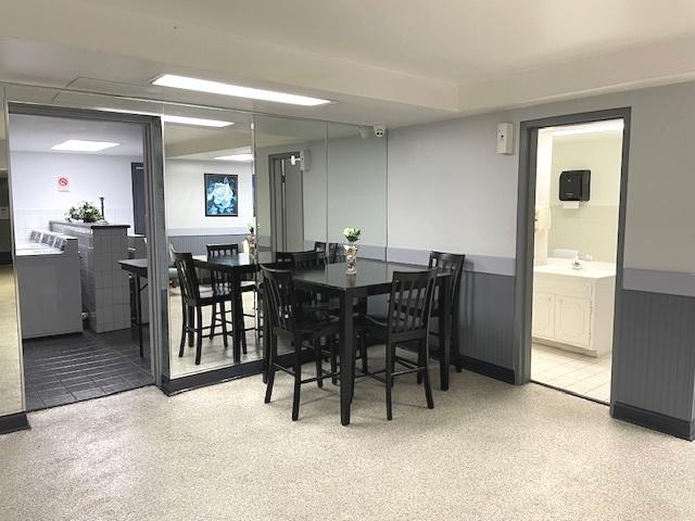6700 S Brainard Ave Unit 223, Countryside, IL 60525 - dining space with a wainscoted wall