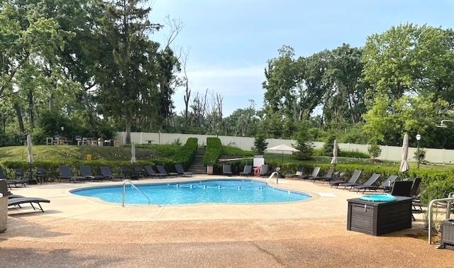 6700 S Brainard Ave Unit 223, Countryside, IL 60525 - community pool featuring a patio area and view of wooded area