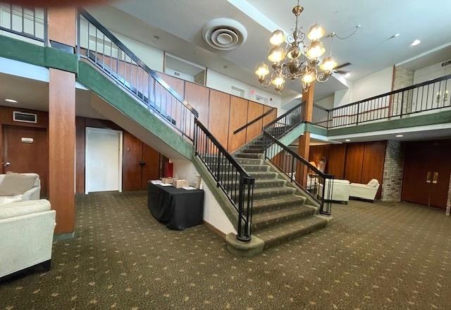 6700 S Brainard Ave Unit 223, Countryside, IL 60525 - community lobby featuring a towering ceiling and stairway