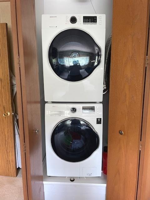 6700 S Brainard Ave Unit 223, Countryside, IL 60525 - laundry room featuring stacked washer and clothes dryer