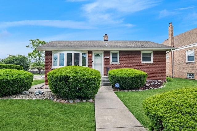 7945 Lawler Ave, Burbank, IL 60459 - single story home with brick siding, a front yard, and a chimney