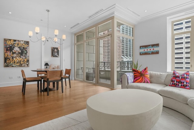 118 E Erie St Unit 14B, Chicago, IL 60611 - living room with crown molding, healthy amount of natural light, a chandelier, wood finished floors, and recessed lighting