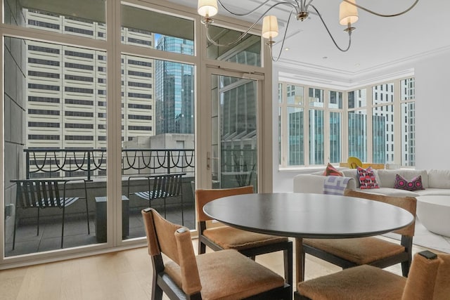 118 E Erie St Unit 14B, Chicago, IL 60611 - dining space with crown molding, wood finished floors, and a chandelier