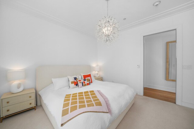 118 E Erie St Unit 14B, Chicago, IL 60611 - carpeted bedroom with a chandelier and crown molding