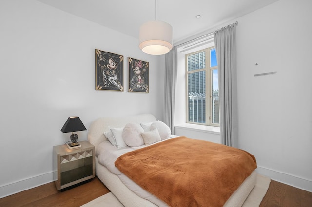 118 E Erie St Unit 14B, Chicago, IL 60611 - bedroom with baseboards and wood finished floors