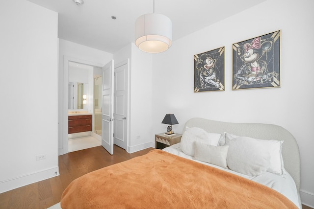 118 E Erie St Unit 14B, Chicago, IL 60611 - bedroom featuring wood finished floors and ensuite bathroom