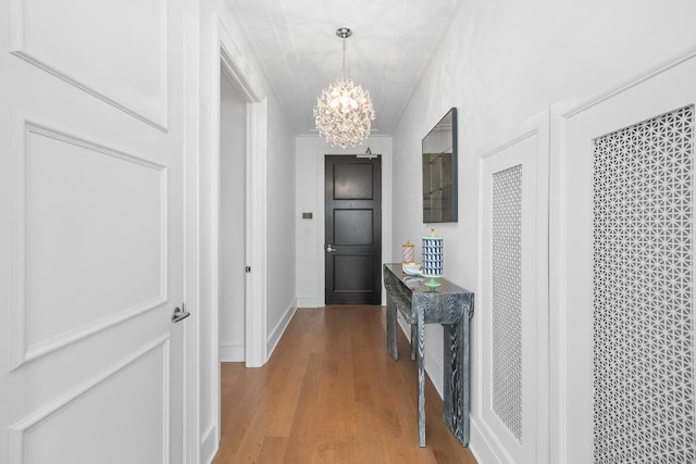 118 E Erie St Unit 14B, Chicago, IL 60611 - hall featuring a chandelier and wood finished floors