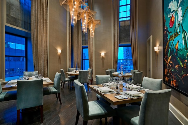 118 E Erie St Unit 14B, Chicago, IL 60611 - dining room with a high ceiling, hardwood / wood-style flooring, and a chandelier
