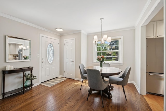 661 E Clarendon Ct, Arlington Heights, IL 60004 - dining area with a chandelier, ornamental molding, and wood finished floors