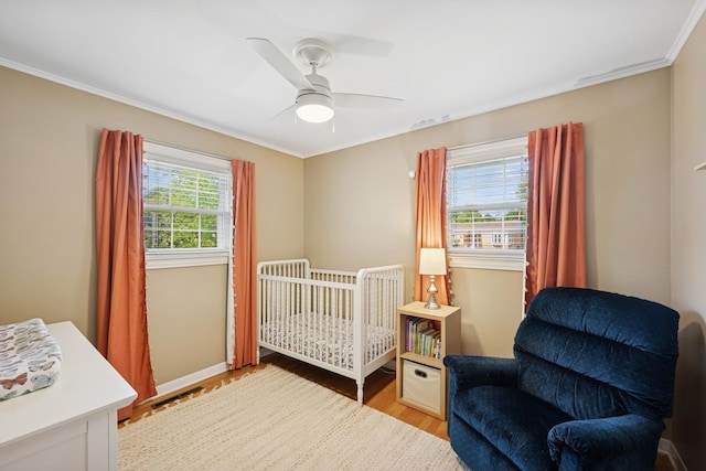 661 E Clarendon Ct, Arlington Heights, IL 60004 - bedroom featuring wood finished floors, crown molding, and a ceiling fan