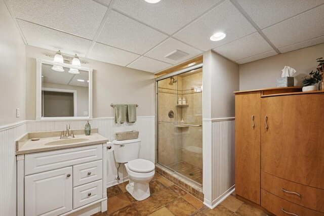 661 E Clarendon Ct, Arlington Heights, IL 60004 - bathroom with wainscoting, a stall shower, vanity, and a paneled ceiling