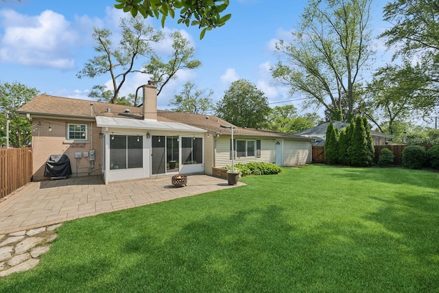 661 E Clarendon Ct, Arlington Heights, IL 60004 - rear view of house with a patio, a fenced backyard, a chimney, and an outdoor fire pit