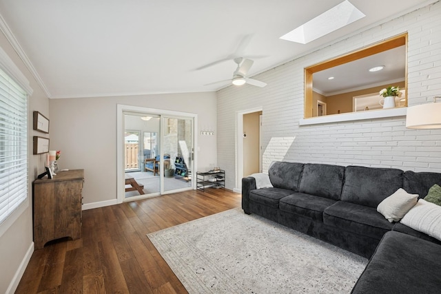661 E Clarendon Ct, Arlington Heights, IL 60004 - living area with a skylight, dark wood-type flooring, brick wall, crown molding, and a ceiling fan