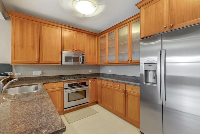 530 N Lake Shore Dr Unit 2408, Chicago, IL 60611 - kitchen featuring appliances with stainless steel finishes, glass insert cabinets, and brown cabinets