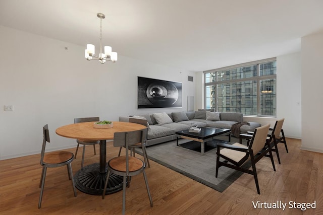 530 N Lake Shore Dr Unit 2408, Chicago, IL 60611 - living area with a chandelier and light wood-style floors
