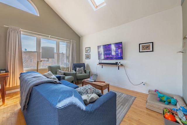 530 N Ashland Ave, Chicago, IL 60622 - living area featuring a skylight, high vaulted ceiling, and hardwood / wood-style flooring