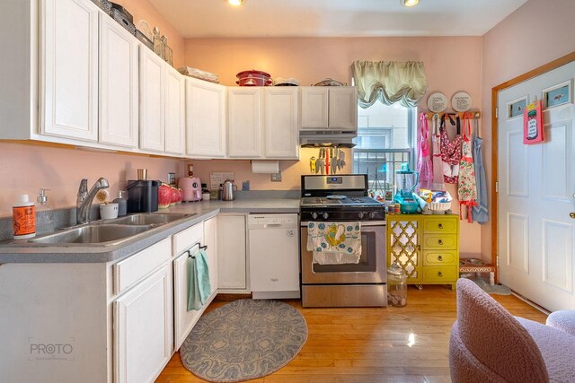 530 N Ashland Ave, Chicago, IL 60622 - kitchen featuring gas stove, dishwasher, under cabinet range hood, light wood-type flooring, and white cabinetry