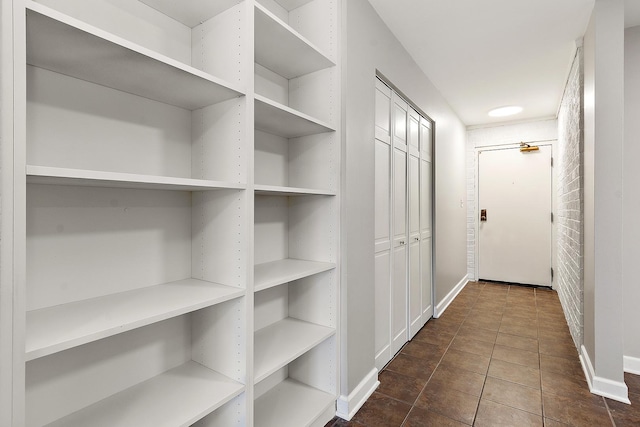 254 E Bailey Rd Unit M, Naperville, IL 60565 - hall featuring baseboards and dark tile patterned flooring