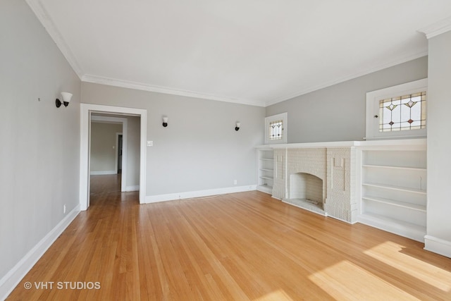 6208 N Artesian Ave, Chicago, IL 60659 - unfurnished living room with crown molding, healthy amount of natural light, a fireplace, and light wood-style floors