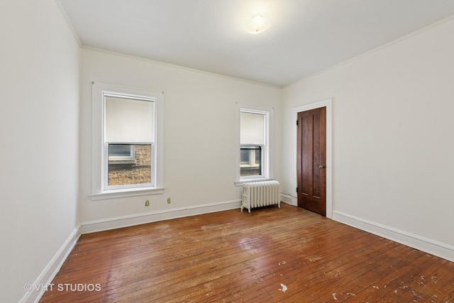 6208 N Artesian Ave, Chicago, IL 60659 - empty room with radiator, hardwood / wood-style floors, and crown molding