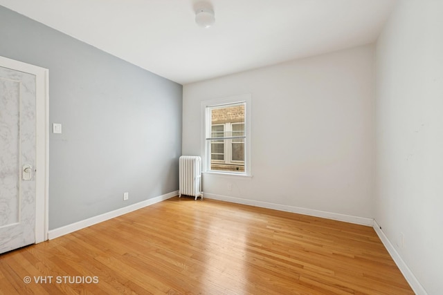 6208 N Artesian Ave, Chicago, IL 60659 - empty room with radiator and light wood-style floors