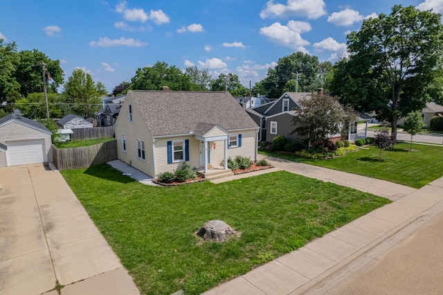416 S Nelson Ave, Morton, IL 61550 - view of front of home with driveway, an outbuilding, a shingled roof, and a residential view