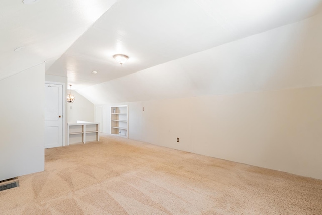 416 S Nelson Ave, Morton, IL 61550 - additional living space with carpet floors, built in shelves, and lofted ceiling
