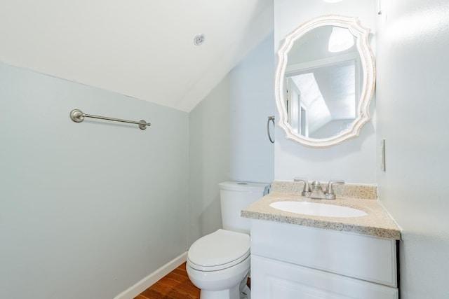 416 S Nelson Ave, Morton, IL 61550 - bathroom with vanity, lofted ceiling, and wood finished floors