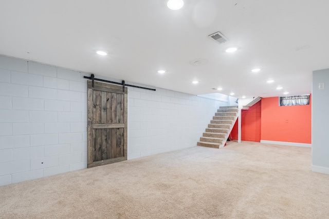 416 S Nelson Ave, Morton, IL 61550 - finished below grade area featuring stairs, carpet, recessed lighting, a barn door, and concrete block wall