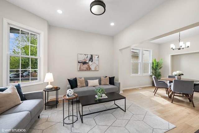 6317 W Cuyler Ave, Chicago, IL 60634 - living room with light wood-style flooring, a chandelier, and recessed lighting