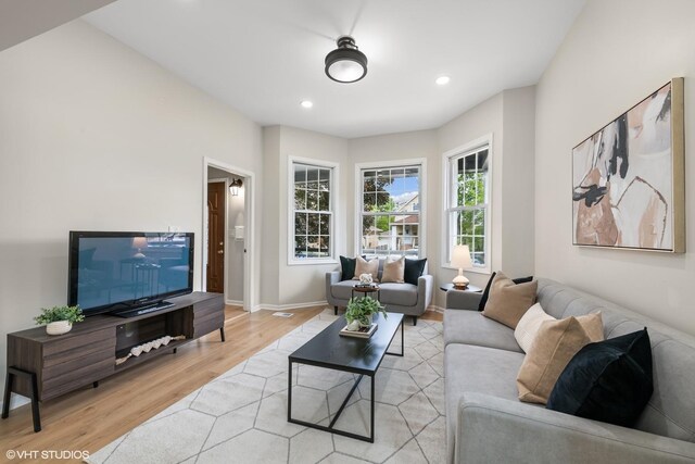 6317 W Cuyler Ave, Chicago, IL 60634 - living room featuring light wood-style flooring and recessed lighting