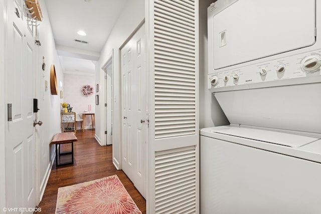2128 N Hudson Ave Unit 204, Chicago, IL 60614 - laundry area with stacked washing machine and dryer and dark wood-style flooring