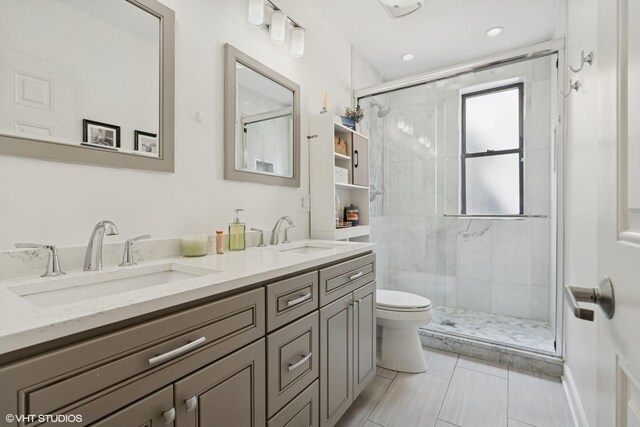 2128 N Hudson Ave Unit 204, Chicago, IL 60614 - bathroom featuring a stall shower and double vanity