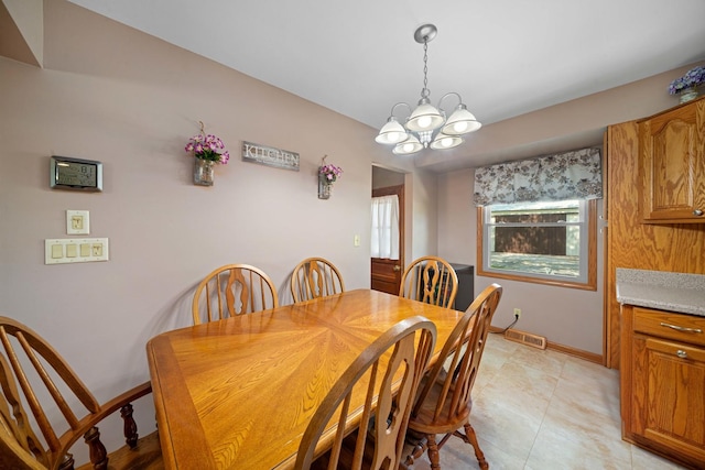 14893 Plank Rd, Sycamore, IL 60178 - dining room featuring a chandelier and light tile patterned floors
