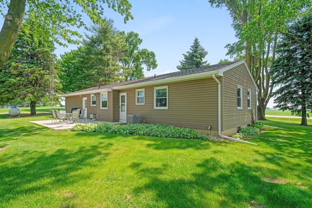 14893 Plank Rd, Sycamore, IL 60178 - back of property with a patio and a lawn