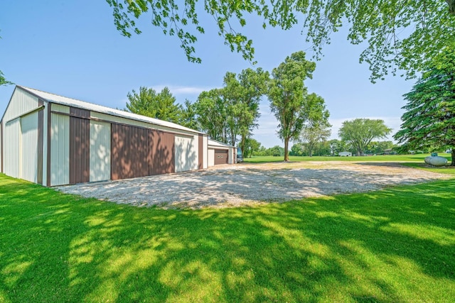 14893 Plank Rd, Sycamore, IL 60178 - view of green lawn with an outbuilding and a detached garage