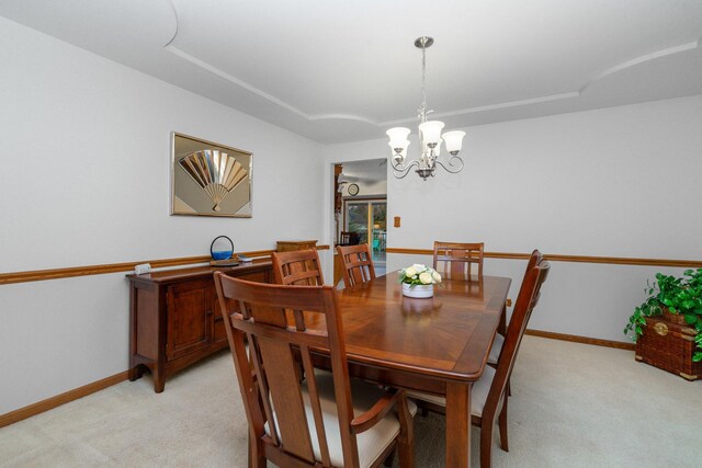 17815 Iroquois, Tinley Park, IL 60477 - dining area featuring light colored carpet, a chandelier, and a tray ceiling