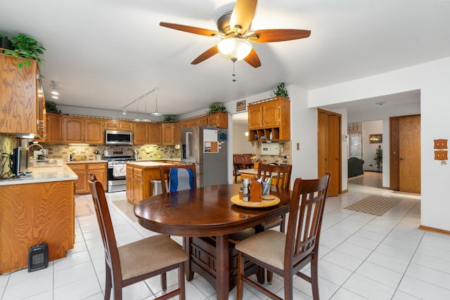 17815 Iroquois, Tinley Park, IL 60477 - dining space with rail lighting, a ceiling fan, and light tile patterned flooring