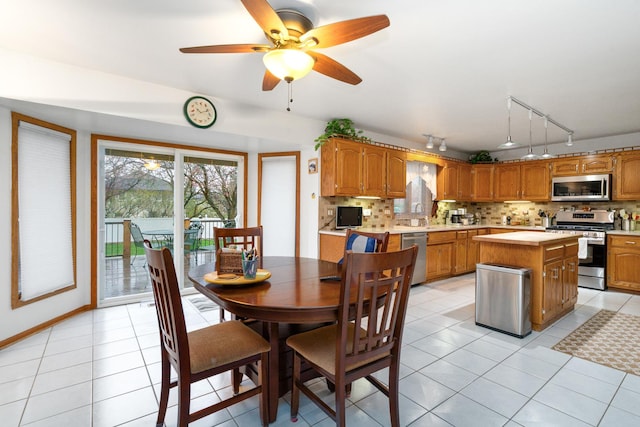 17815 Iroquois, Tinley Park, IL 60477 - dining area featuring rail lighting, healthy amount of natural light, light tile patterned floors, and ceiling fan