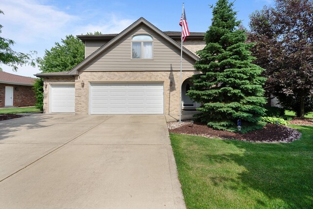 17815 Iroquois, Tinley Park, IL 60477 - traditional home featuring concrete driveway, a front lawn, and brick siding