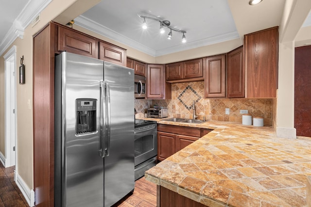 6401 W Home Ave Unit 6A, Worth, IL 60482 - kitchen featuring stainless steel appliances, a peninsula, decorative backsplash, crown molding, and tile countertops
