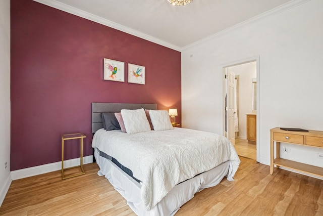 1720 W Diversey Pkwy Unit 1, Chicago, IL 60614 - bedroom featuring light wood-type flooring, crown molding, and connected bathroom