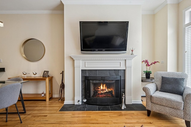 1720 W Diversey Pkwy Unit 1, Chicago, IL 60614 - living room featuring wood finished floors, a fireplace, and crown molding