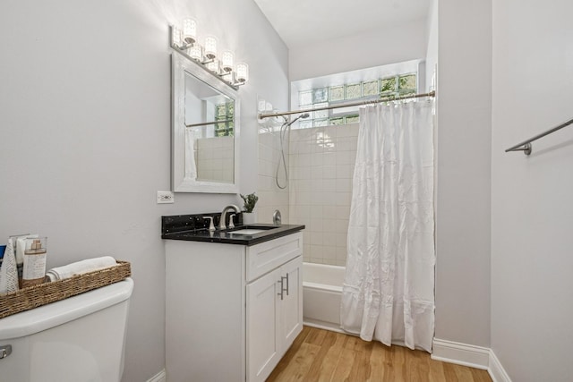 1720 W Diversey Pkwy Unit 1, Chicago, IL 60614 - full bath featuring wood finished floors, shower / tub combo, and vanity